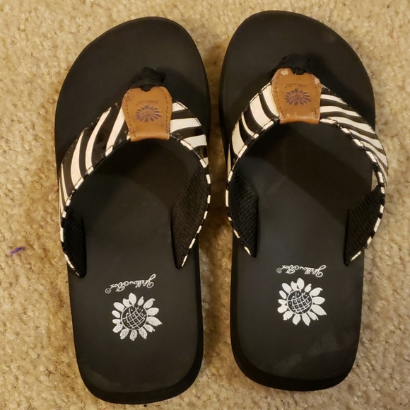 yellow box zebra flip flops